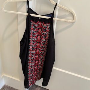 Beautiful black tank with pattern and button closure in back. Size small.
